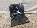 A photo of a Dell Latitude XT2 laptop.